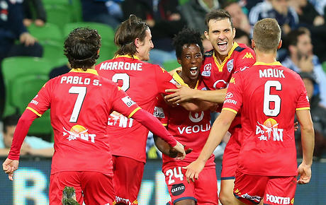 MELBOURNE, AUSTRALIA - FEBRUARY 19: Bruce Kamau of United is congratulated by team mates after scoring a goal during the round 20 A-League match between Melbourne Victory and Adelaide United at AAMI Park on February 19, 2016 in Melbourne, Australia. (Photo by Quinn Rooney/Getty Images)
