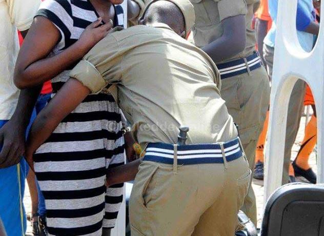 PHOTOS Of Ugandan Police Fondling Women In The Name Of Security Checks