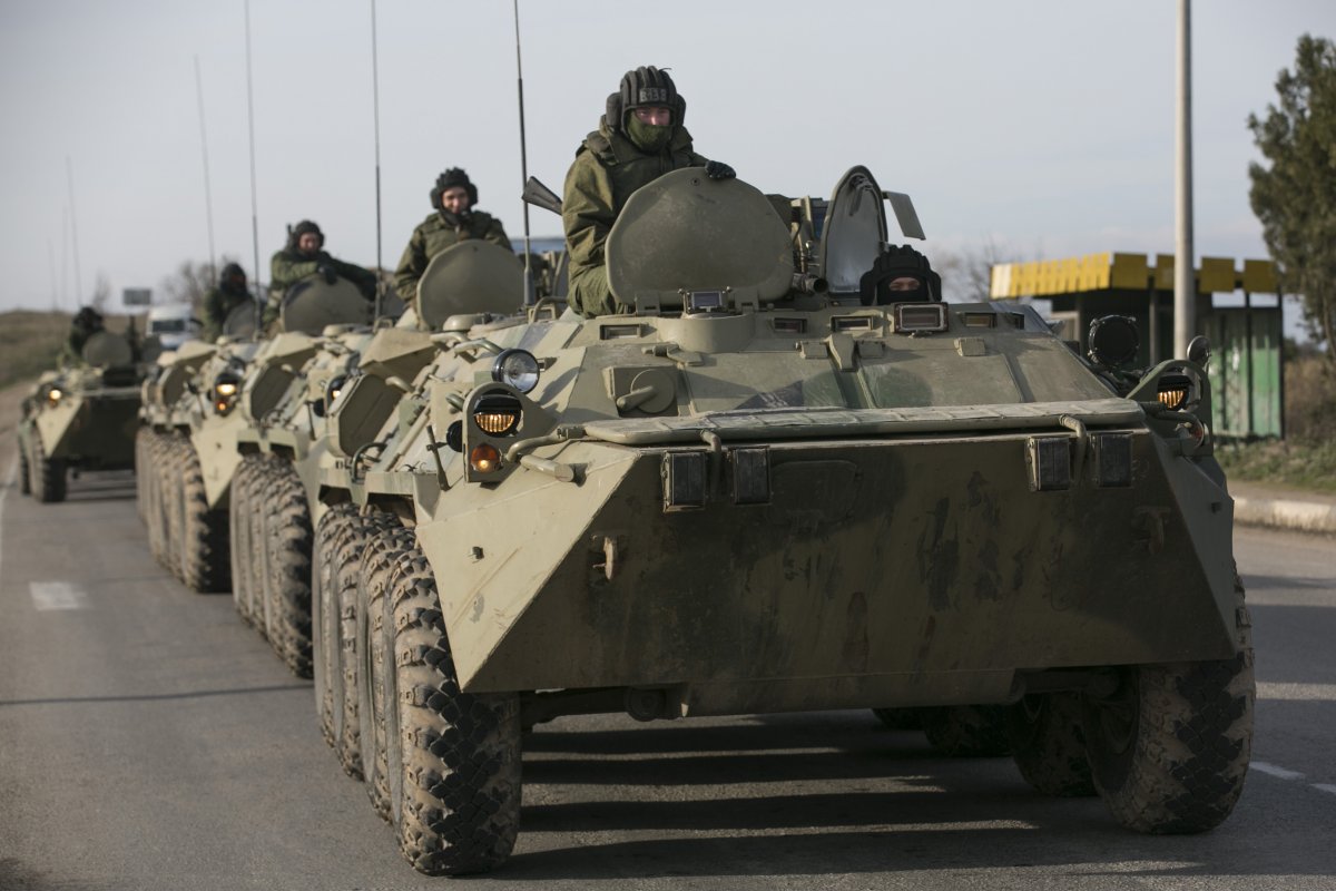 Russian soldiers on military armored-personnel carriers on a road near the Crimean port city of Sevastopol on March 10, 2014. (REUTERS/Baz Ratner)