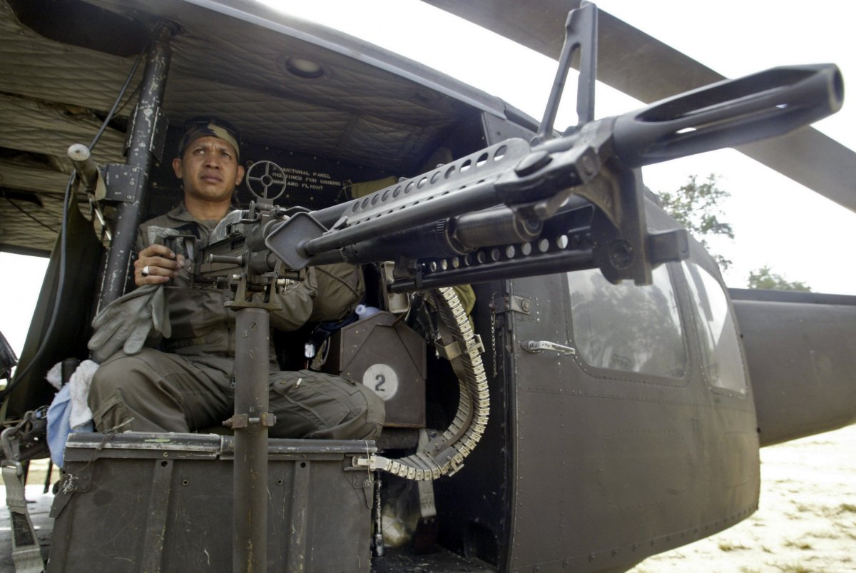A Thai solider keeps guard from a military helicopter after arriving in southern Thailand's Narathiwat Province on March 2, 2007. (Surapan Boonthanom/REUTERS)