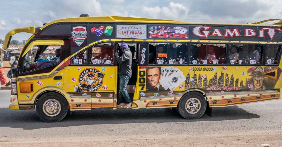 Image result for Tout collecting fare in a matatu Nairobi