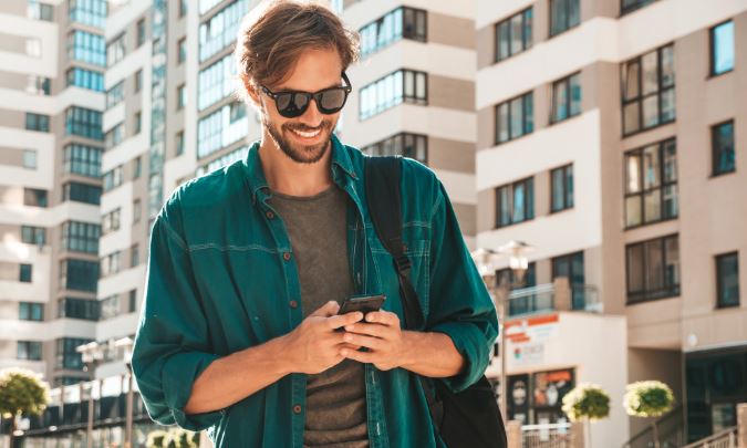 Smiling man with phone